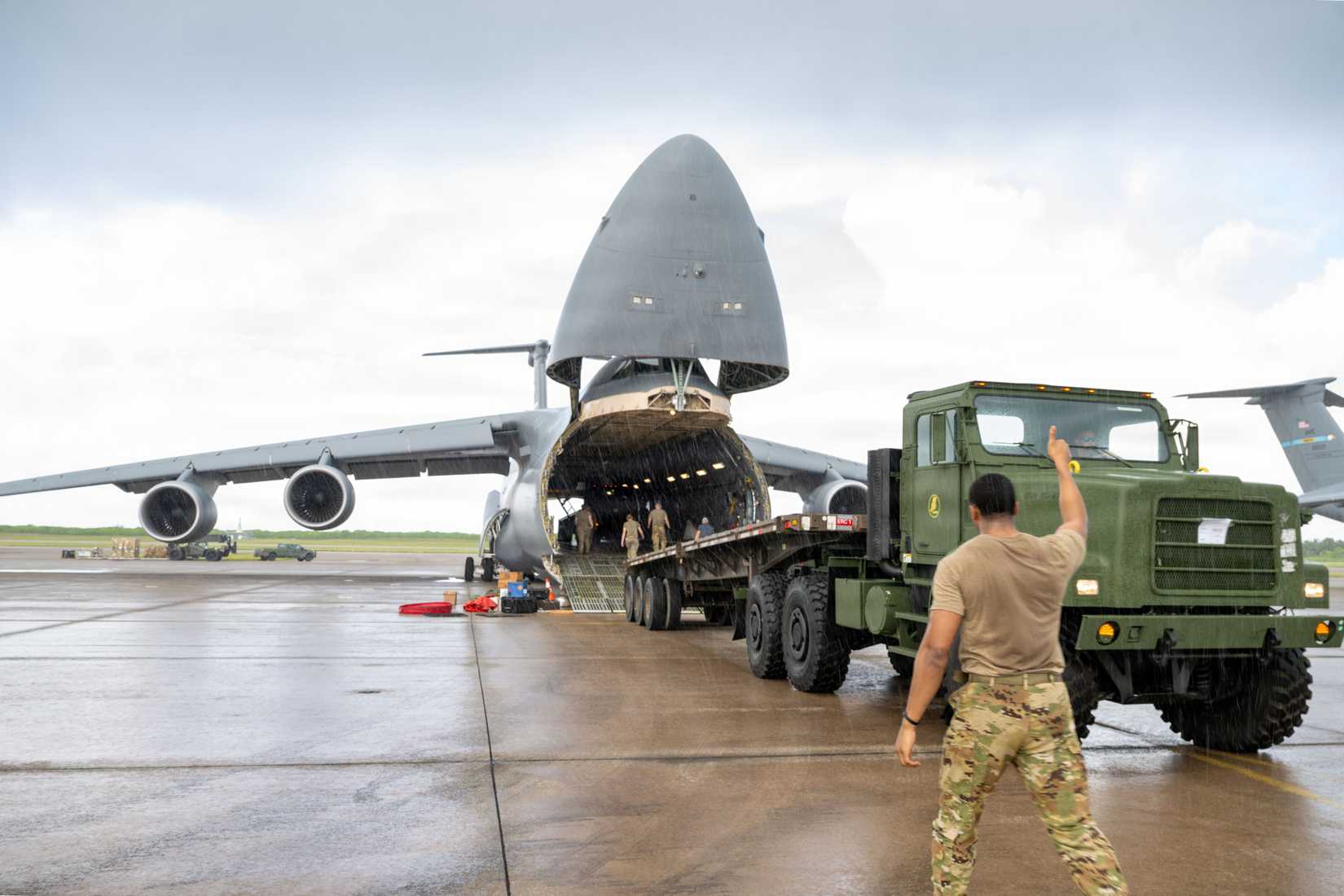 Airman First Class Chavis Marshall, 9th Airlift Squadron loadmaster, gives a thumbs-up after a truck drives out of a C-5M Super Galaxy at Diego Garcia, British Indian Ocean Territory, April 25, 2026.-1