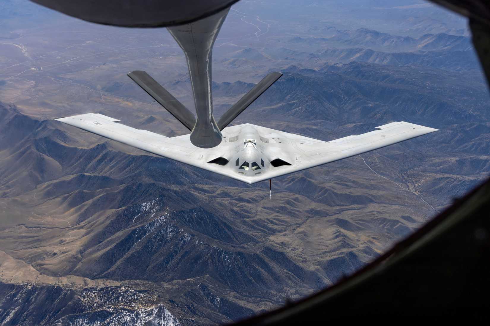 A B-21 Raider rejoins with a KC-135 Stratotanker.