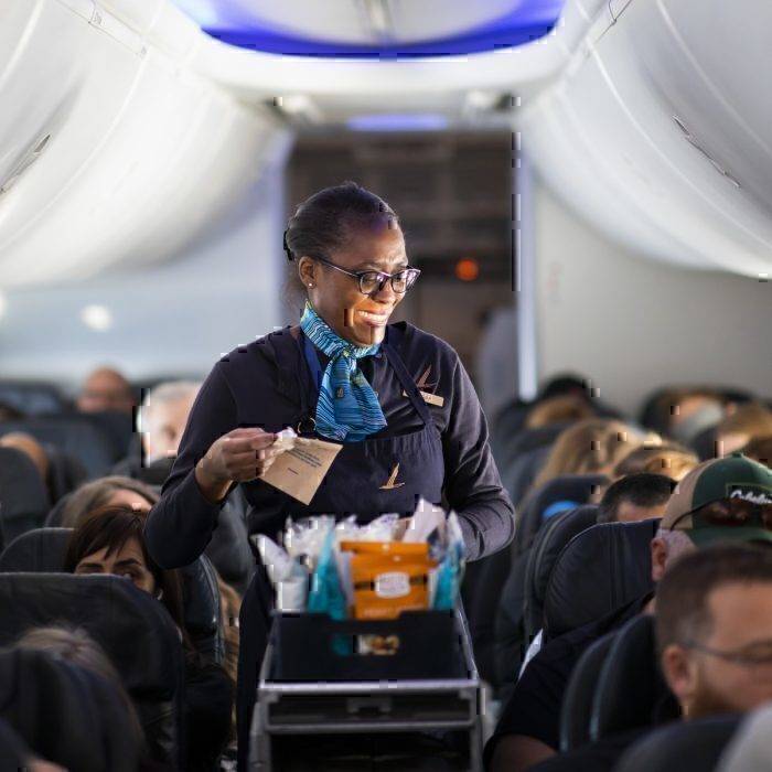 Flight attendant for alaska airlines does cabin service