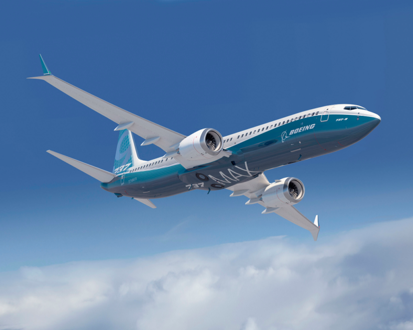 Boeing 737 MAX flying with MAX sign visable under the belly