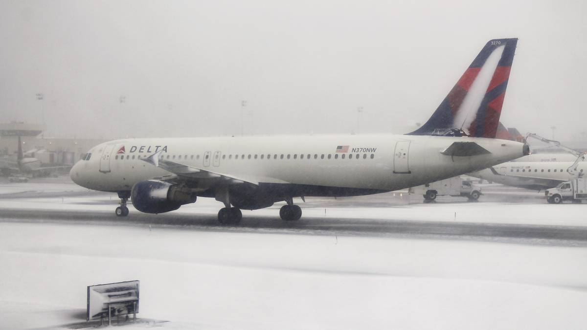 US Flight Cancellations Continue As Weather And Omicron Take A Toll