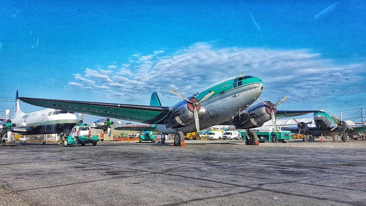 A Buffalo Airways Curtiss-Wright C-46 Commando parked at an airport.