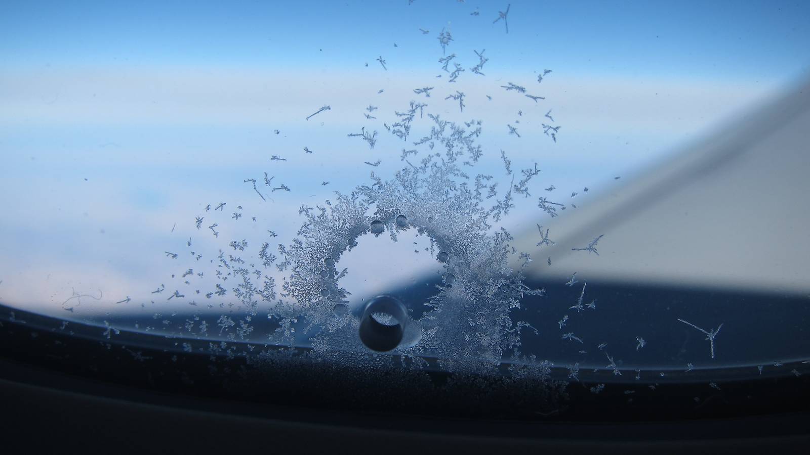 Here's Why Airplane Windows Have Tiny Holes