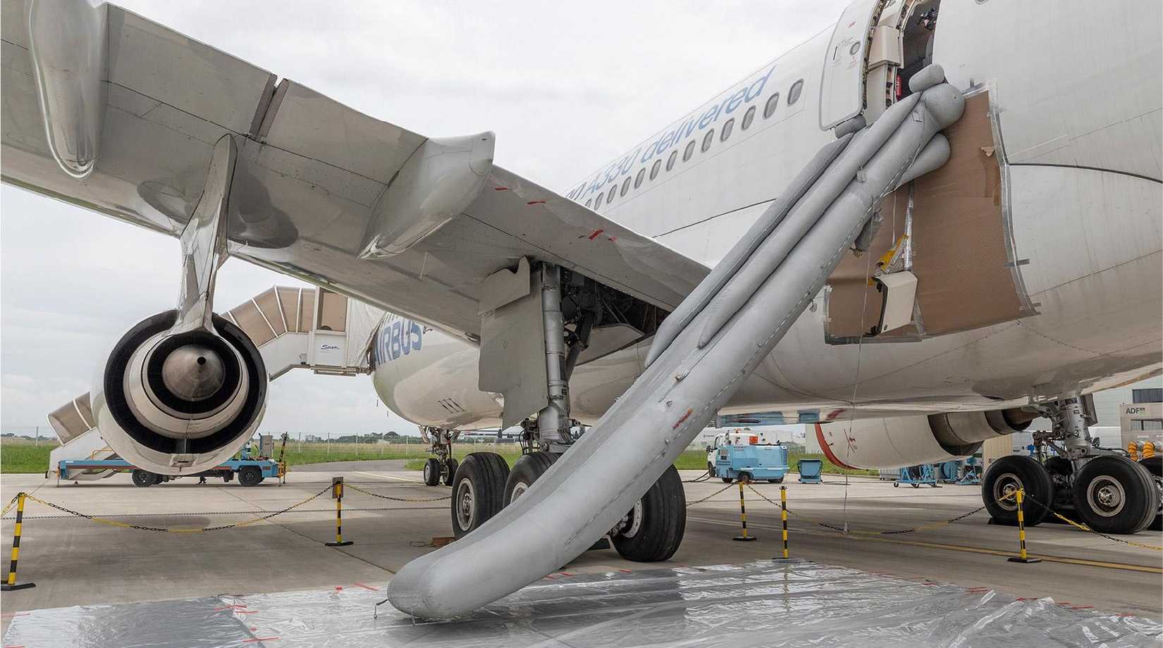 An Airbus aircraft with one of its slides deployed.