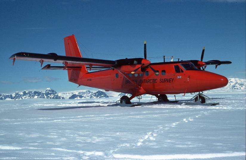 A British Antarctic Survey DHC-6 Twin Otter parked in snow.