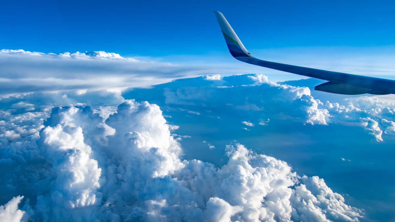 An Alaska Airlines A321 Over Clouds