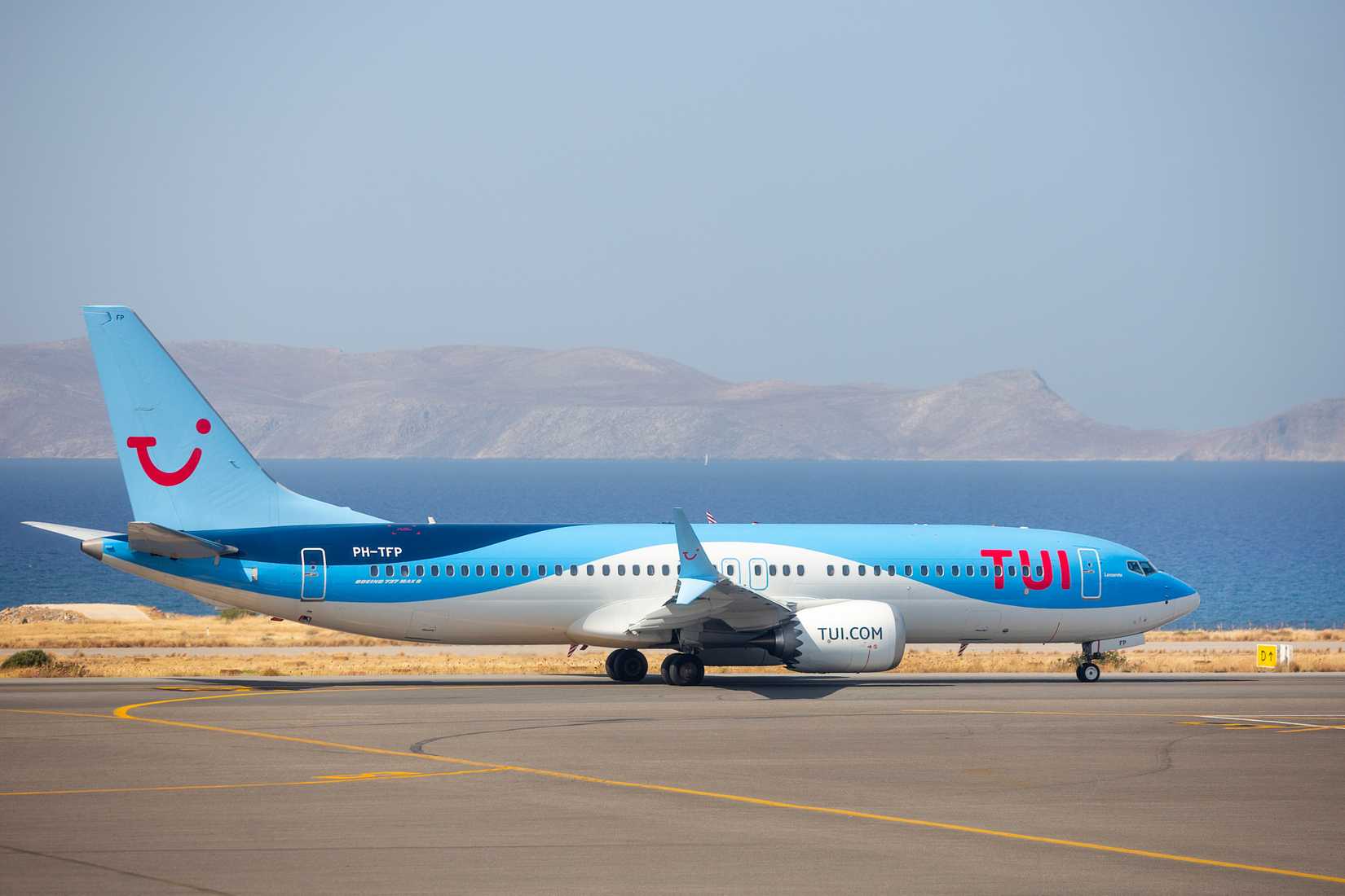 A TUI Airways Boeing 737 Max 8 (PH-TFP) taxis at Heraklion International Airport.