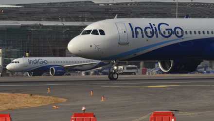 Multiple IndiGo A320s parked at Hyderabad Airport .