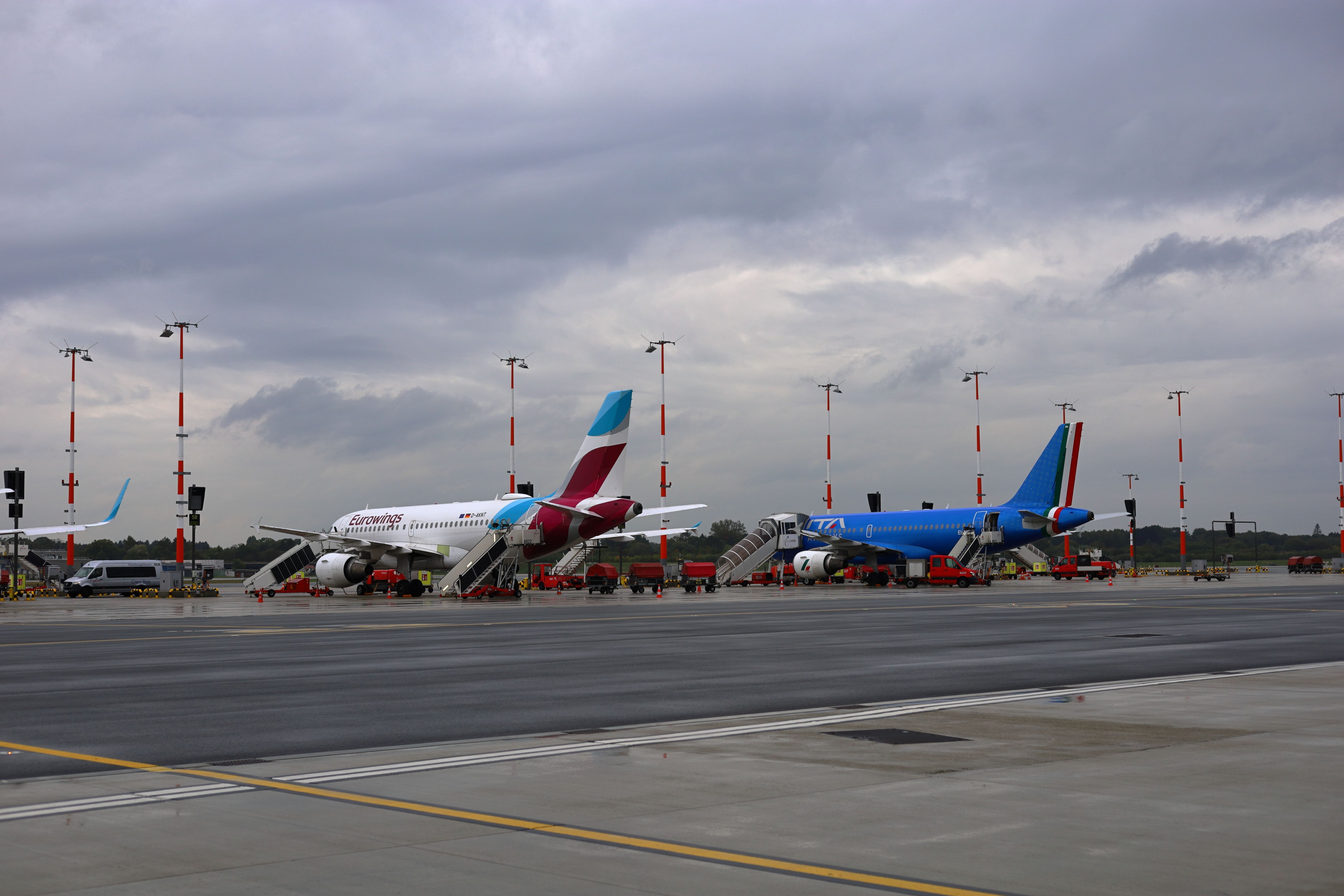 Hamburg, Germany - 09 26 22: Eurowings Airbus A319 registration D-AKNT cn2607 and ITA airways A319 registration EI-IMN cn4764 parked on remote stand at Hamburg Airport