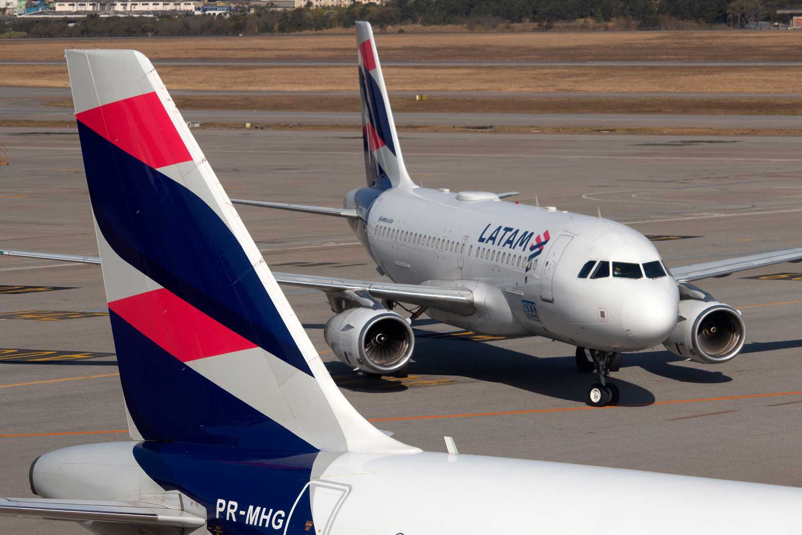 Airplane and tail of a Latam Linhas Aereas airbus a320 airplane Guarulhos Sao Paulo, Brazil 2021