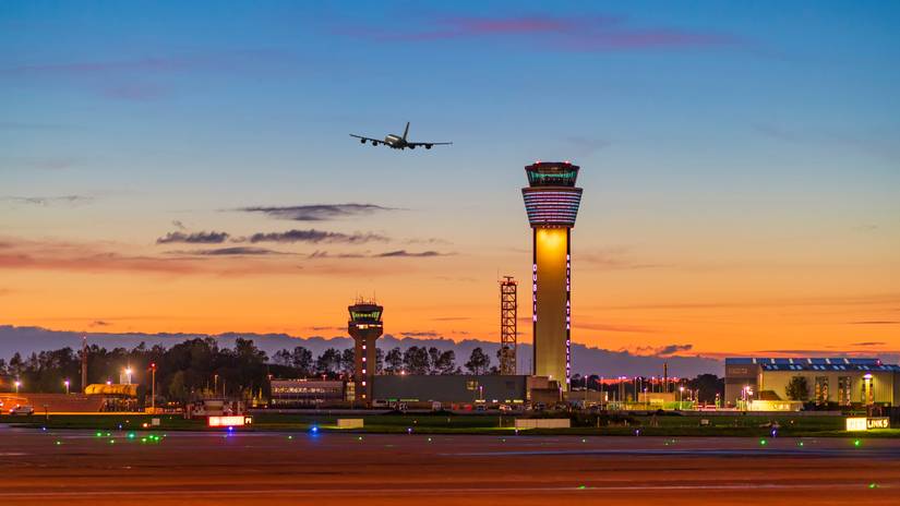 A clear night at Dublin Airport with a quad engine aircraft taking off.
