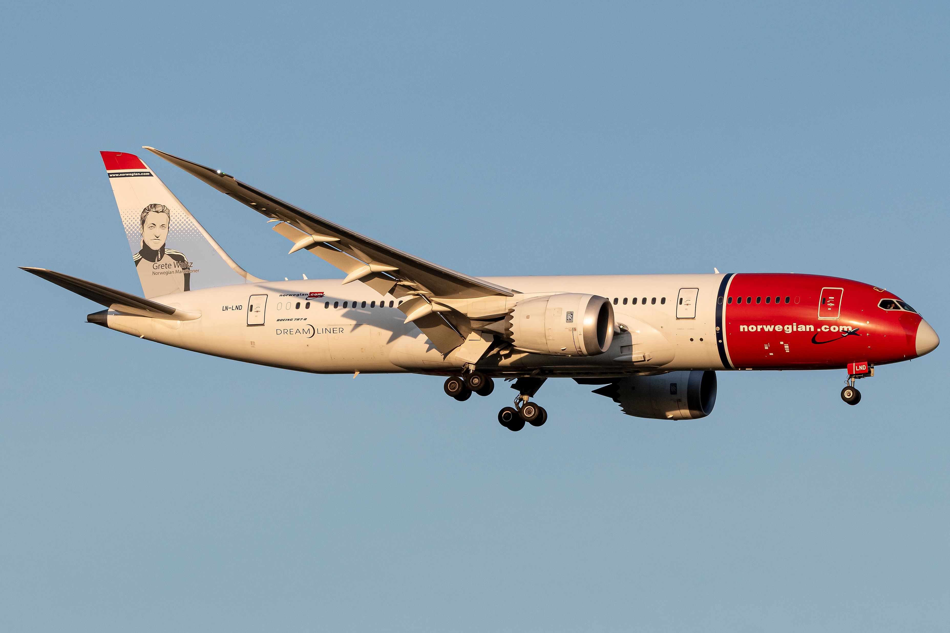A Norwegian Boeing 787-8 Dreamliner flying in the sky.