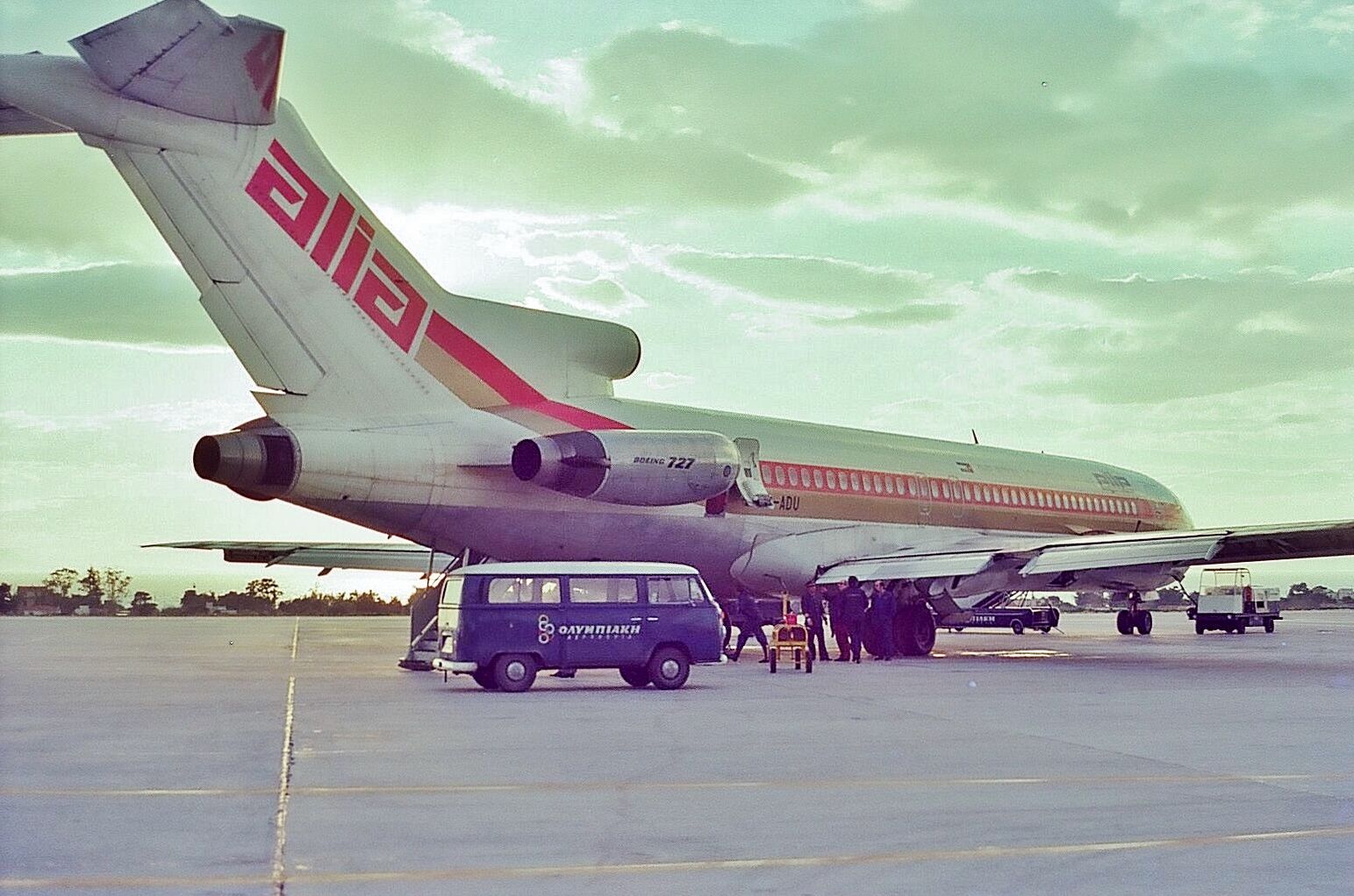 A Royal Jordinian Boeing 727 parked at an airfield.