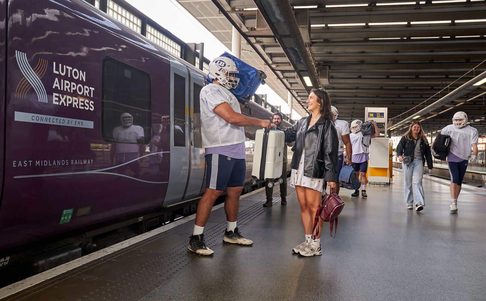 London Luton Airport Showcases Stress Free Travel With Football Players Carrying Luggage