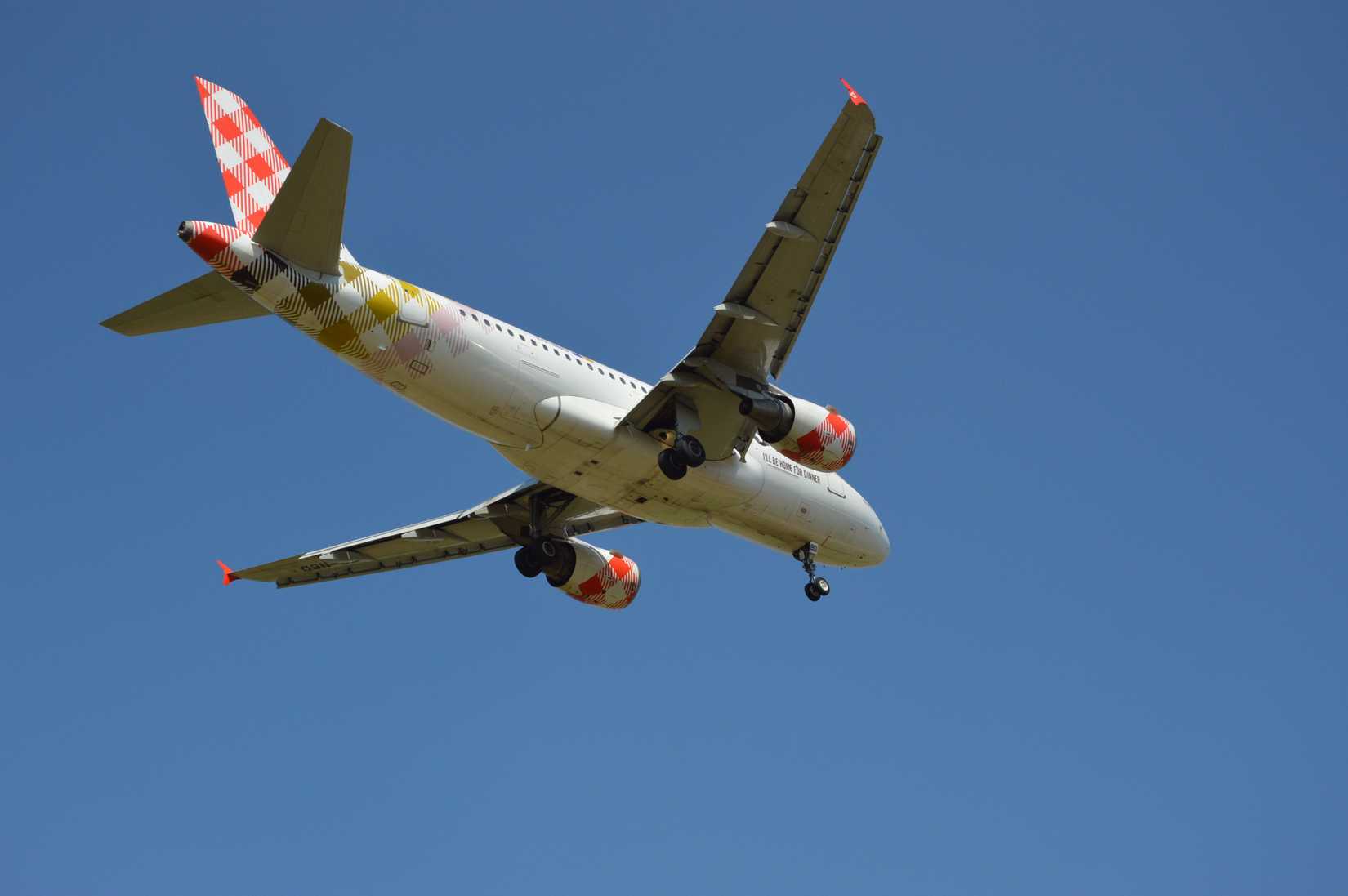 A Volotea jet flies overhead