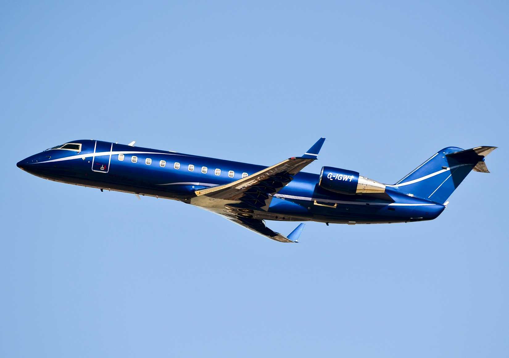 An Ocean Sky Bombardier Challenger 850 flying in the sky.