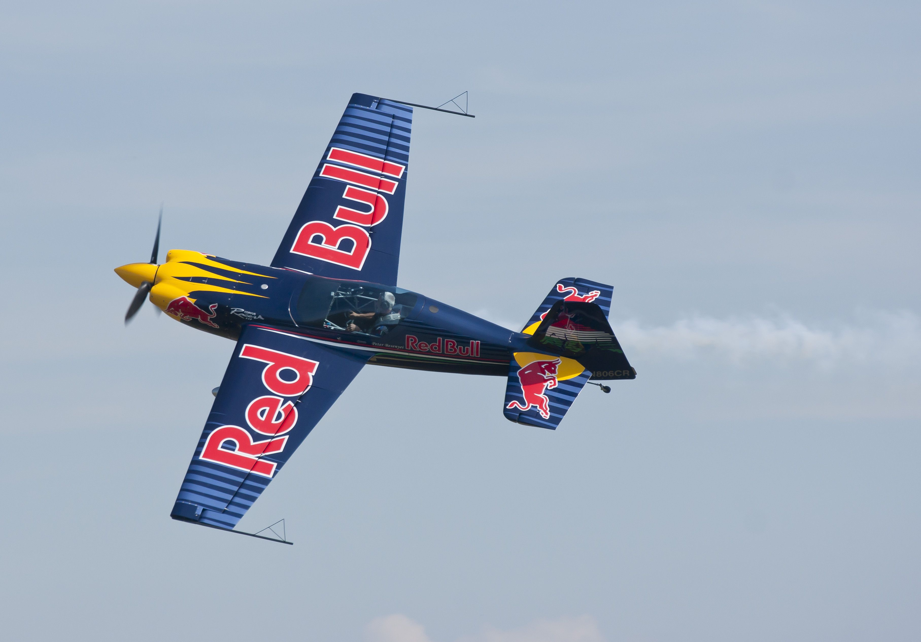 A Red Bull aircraft flying in the sky.