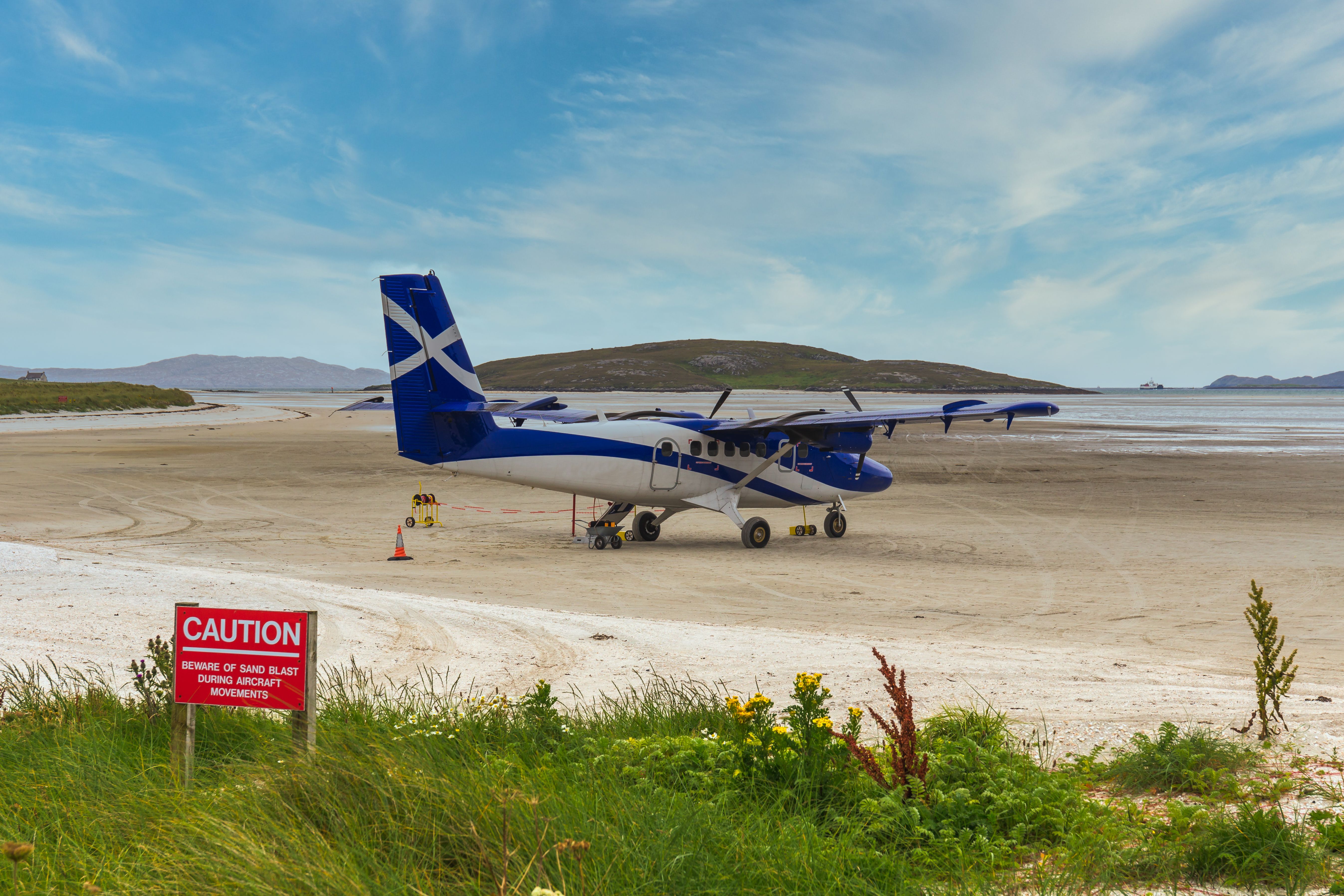 A plane parked at Barra Airport.