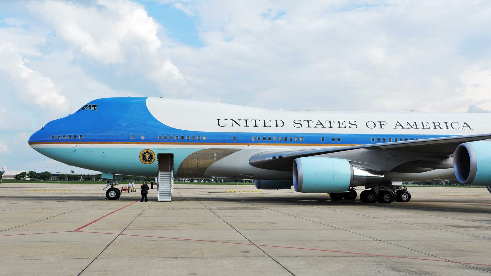 A Boeing 747 VC-25 parked on an airport apron.