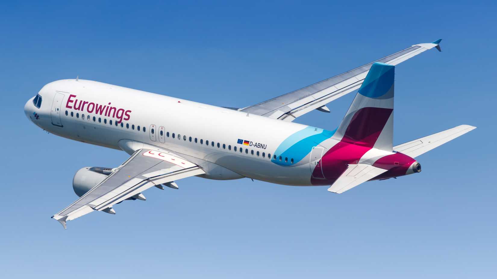 A Eurowings Airbus A320 flying in the sky.