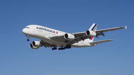An Air France Airbus A380 flying in the sky.