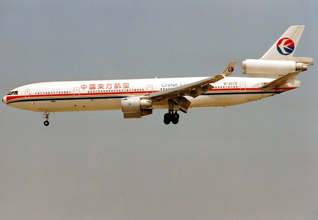 A China Eastern Airlines McDonnell Douglas MD-11 flying in the sky.