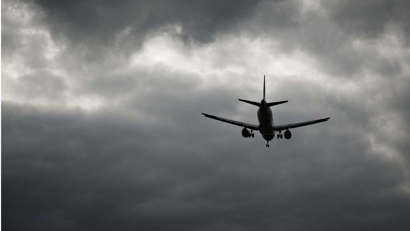 An Aircraft flying in bad weather.