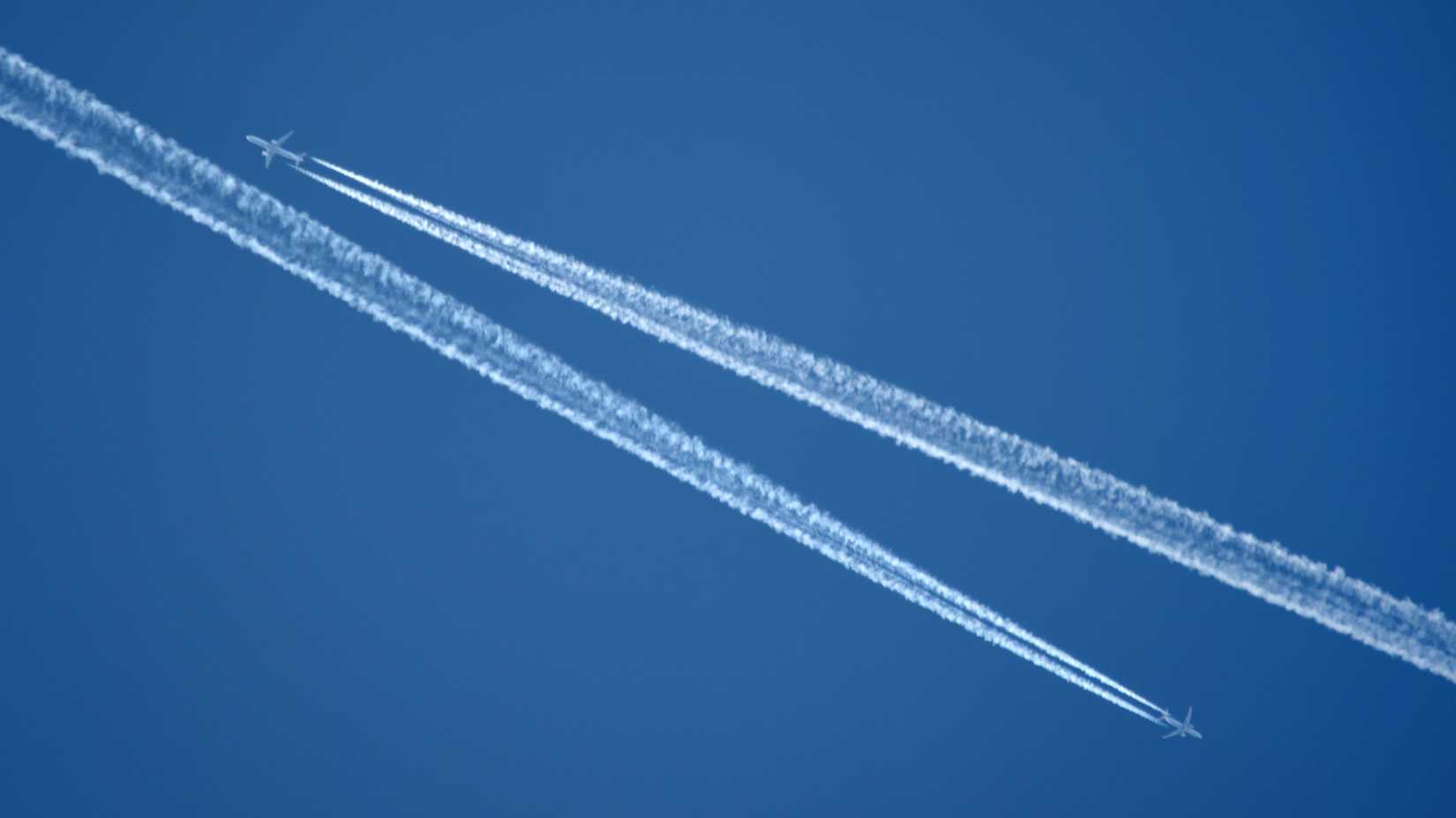 Contrails in the sky of two planes that passed each other in cruise.