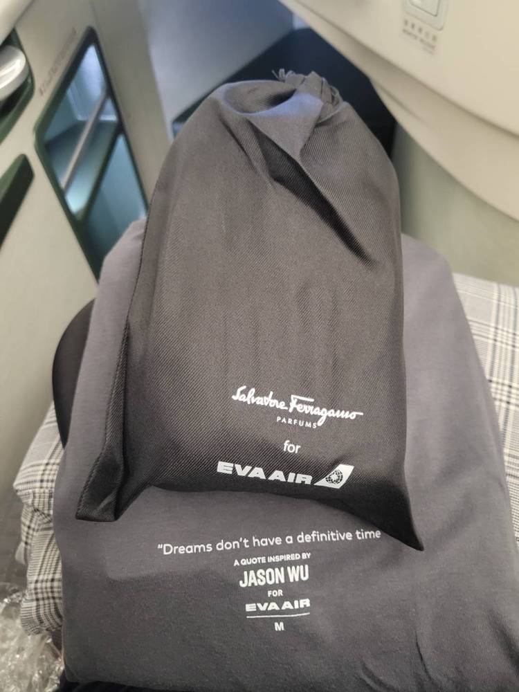 An EVA Air business class amenity kit and pajamas.