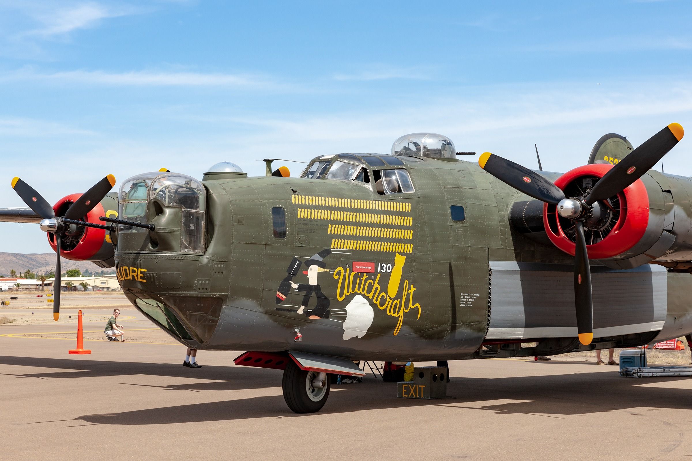 A B-24 Liberator parked at an airfield.