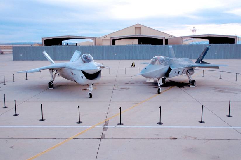 A Boeing X-32 and Lockheed Martin X-35 parked side by side at the Edwards Air Force Base.