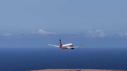 A Boeing 737-800 in British Airways livery taking off from Saint Helena Airport.