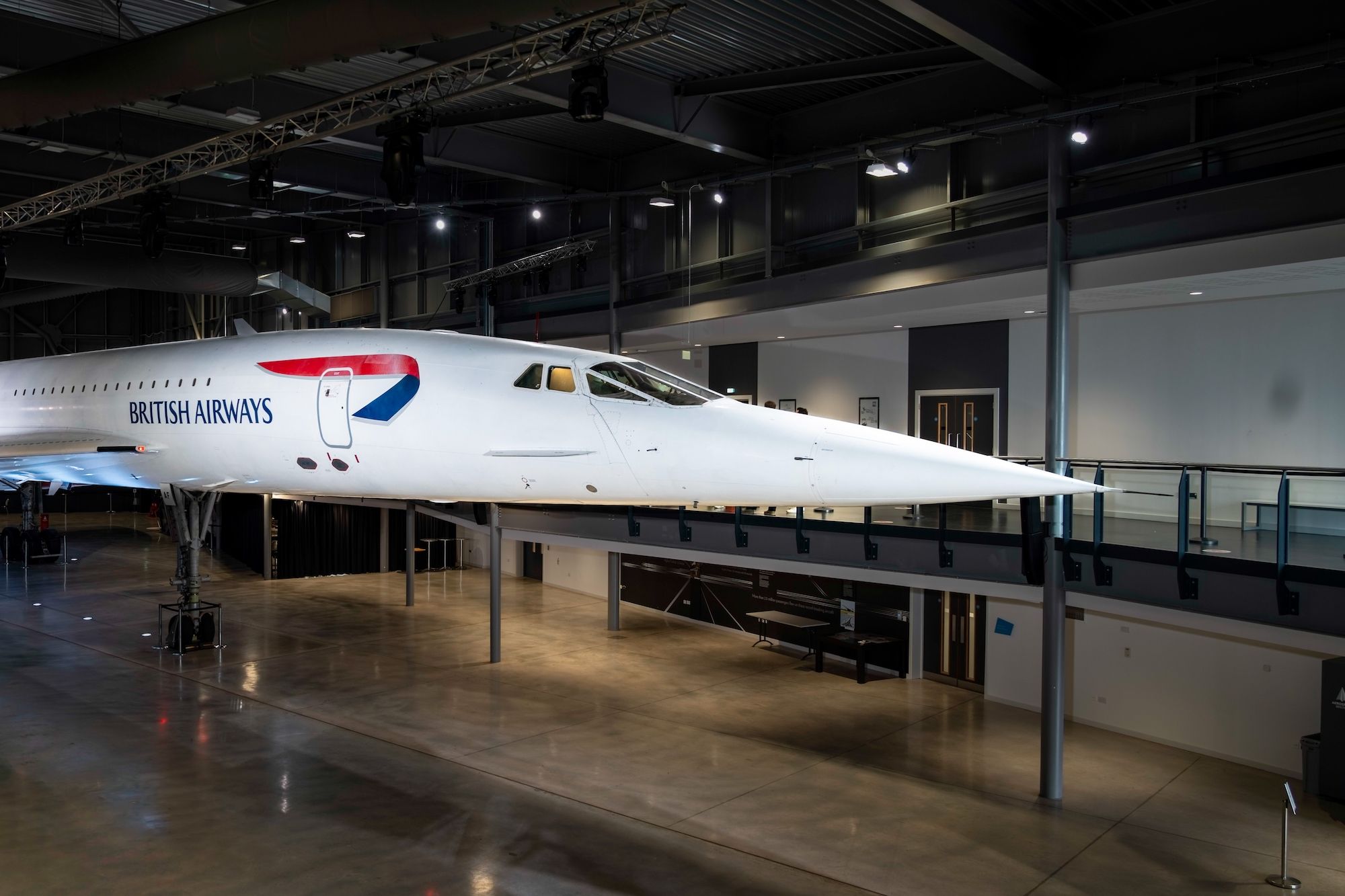 A Concorde airframe sitting in a museum.