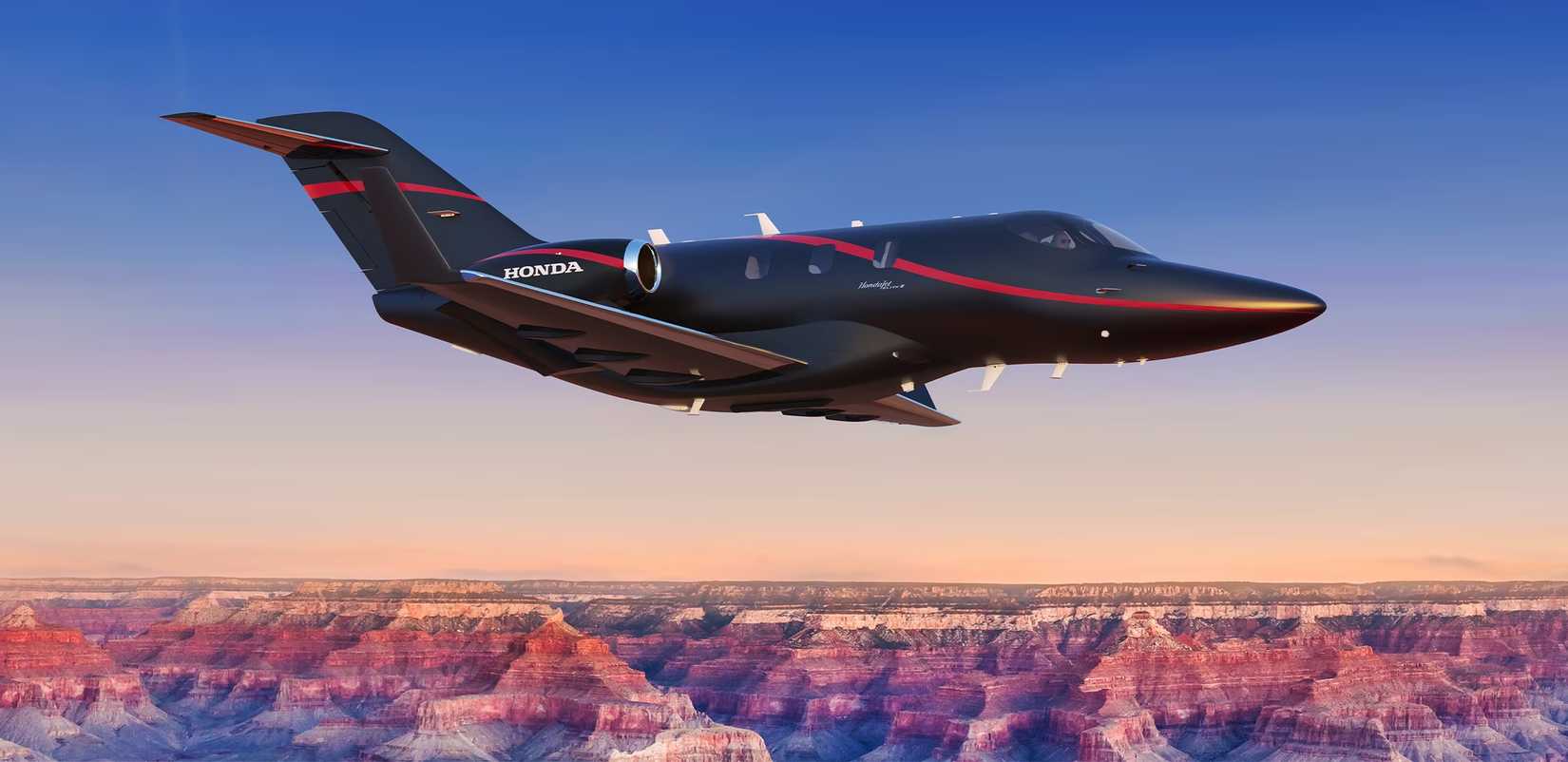 A HondaJet Elite II flying above the clouds.