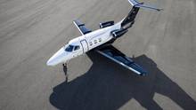 An Embraer Phenom 100EX on an airport apron.