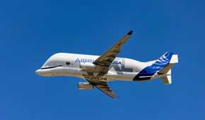 An Airbus BelugaXL flying in the sky.
