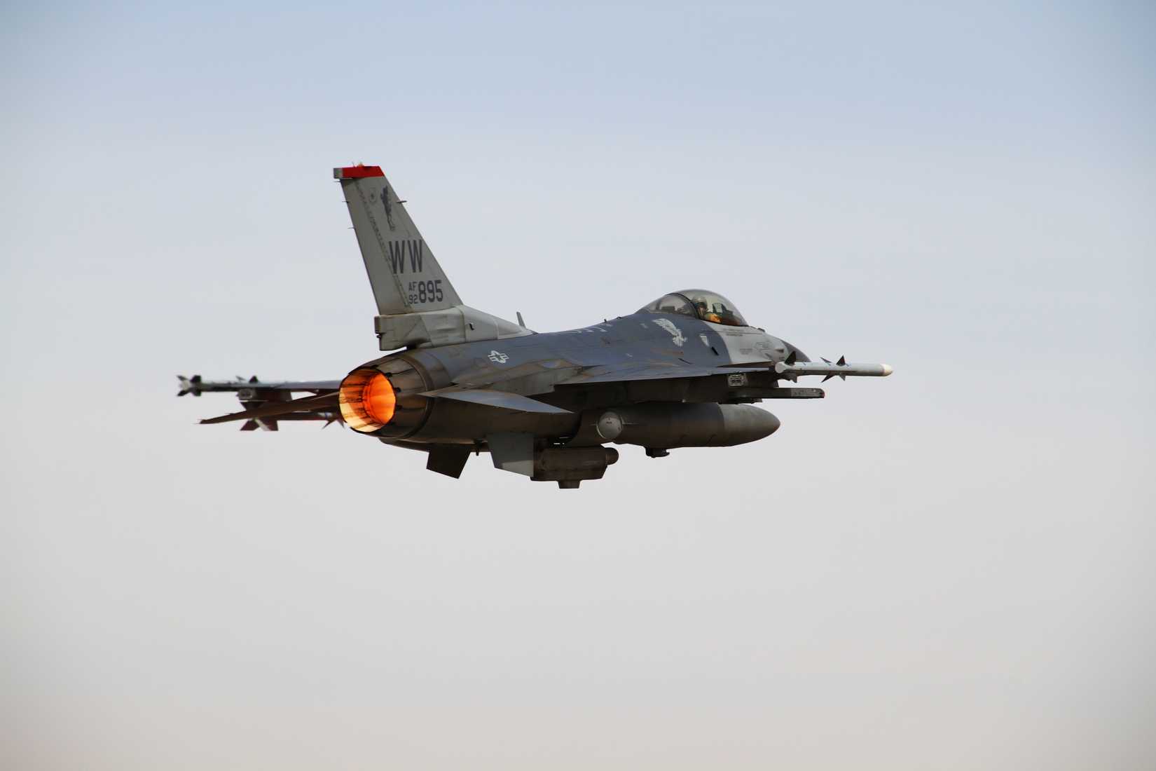 An F-16 fighter jet seen from behind.