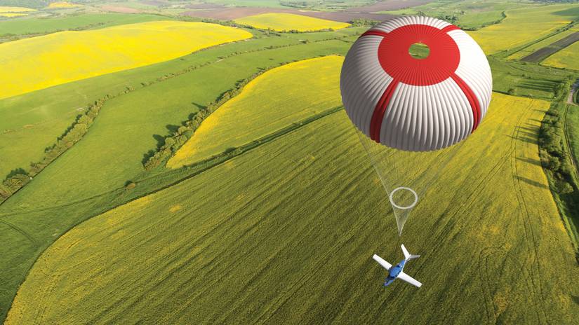A Cirrus Vision Jet with its parachute deployed.