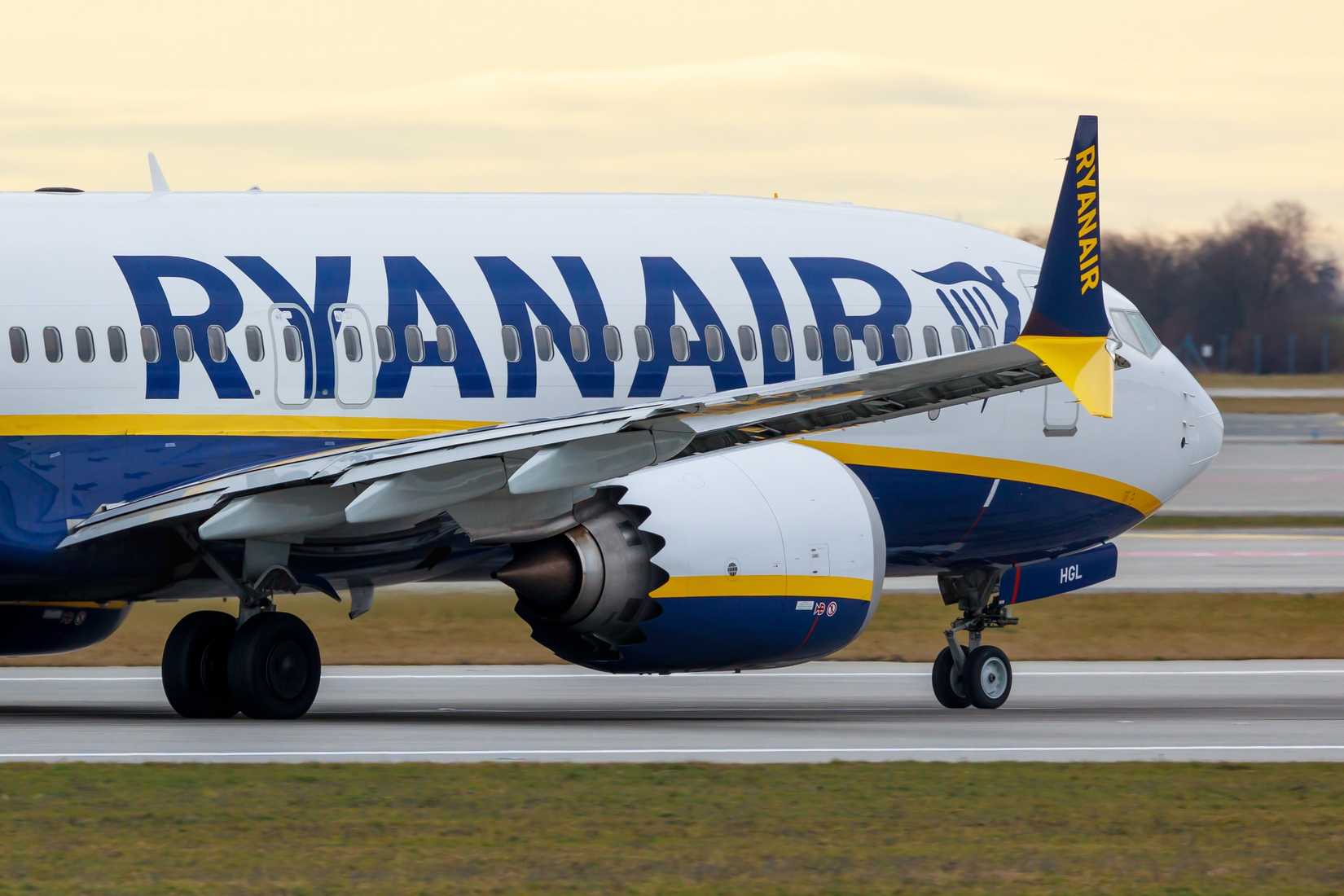 A Ryanair Boeing 737 MAX 8-200 on an airport apron.