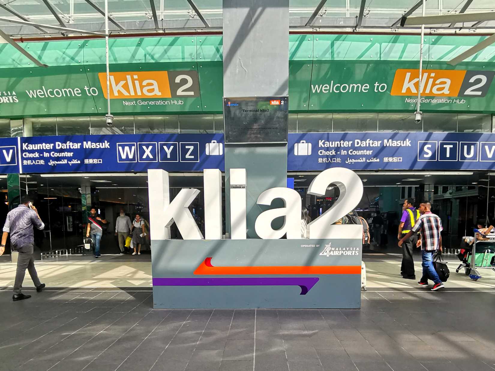 A sign that says "KLIA2" right outside Kuala Lumpur International Airport's Terminal 2.