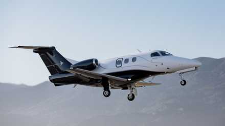 Embraer Phenom 100EX in flight