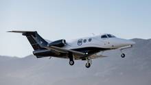 Embraer Phenom 100EX in flight