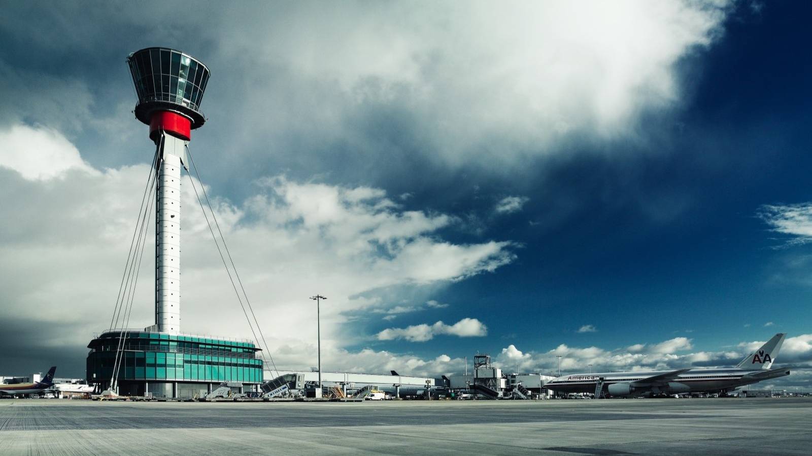 A Panoramic view of London Heathrow Airport with its Air Traffic Control Tower prominently in the view.
