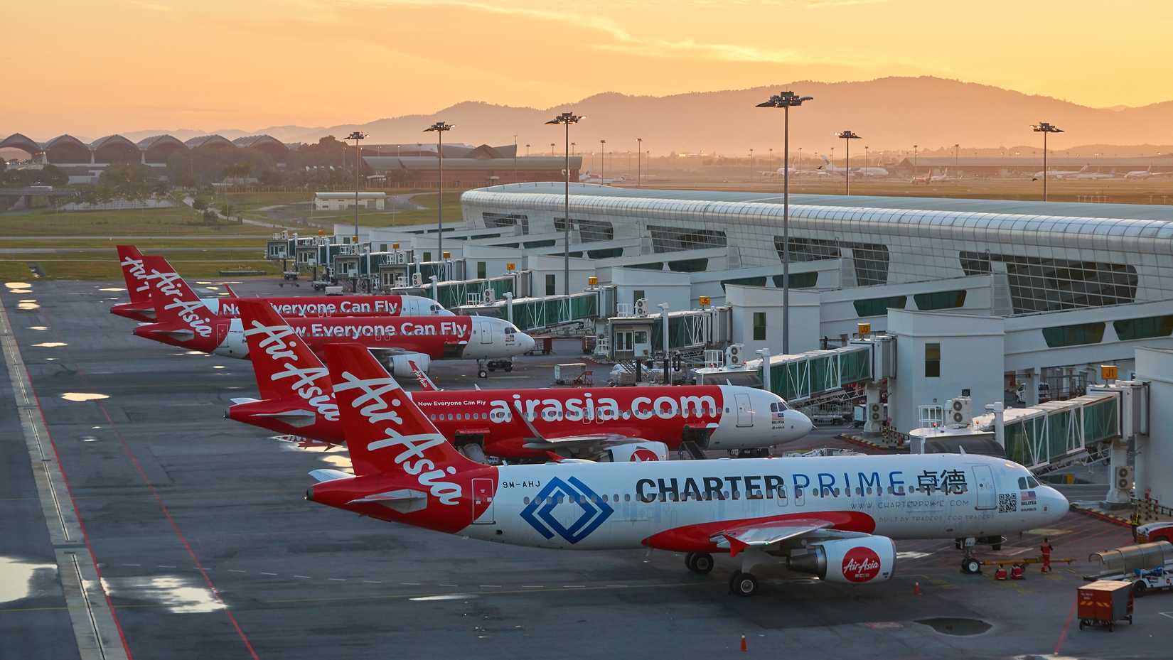 Several AirAsia aircraft parked at Kuala Lumpur International Airport Terminal 2