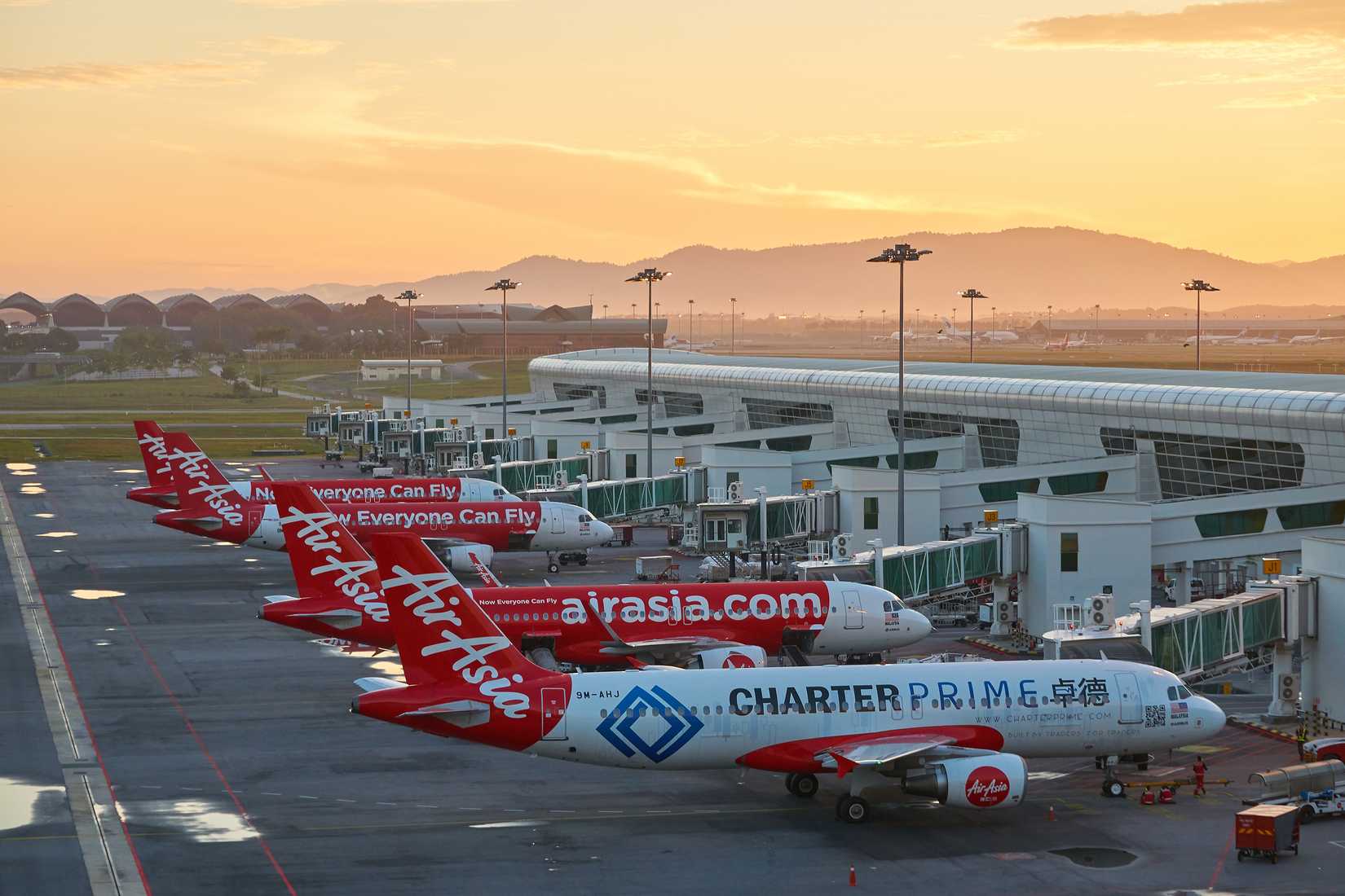 Several AirAsia aircraft parked at Kuala Lumpur International Airport Terminal 2