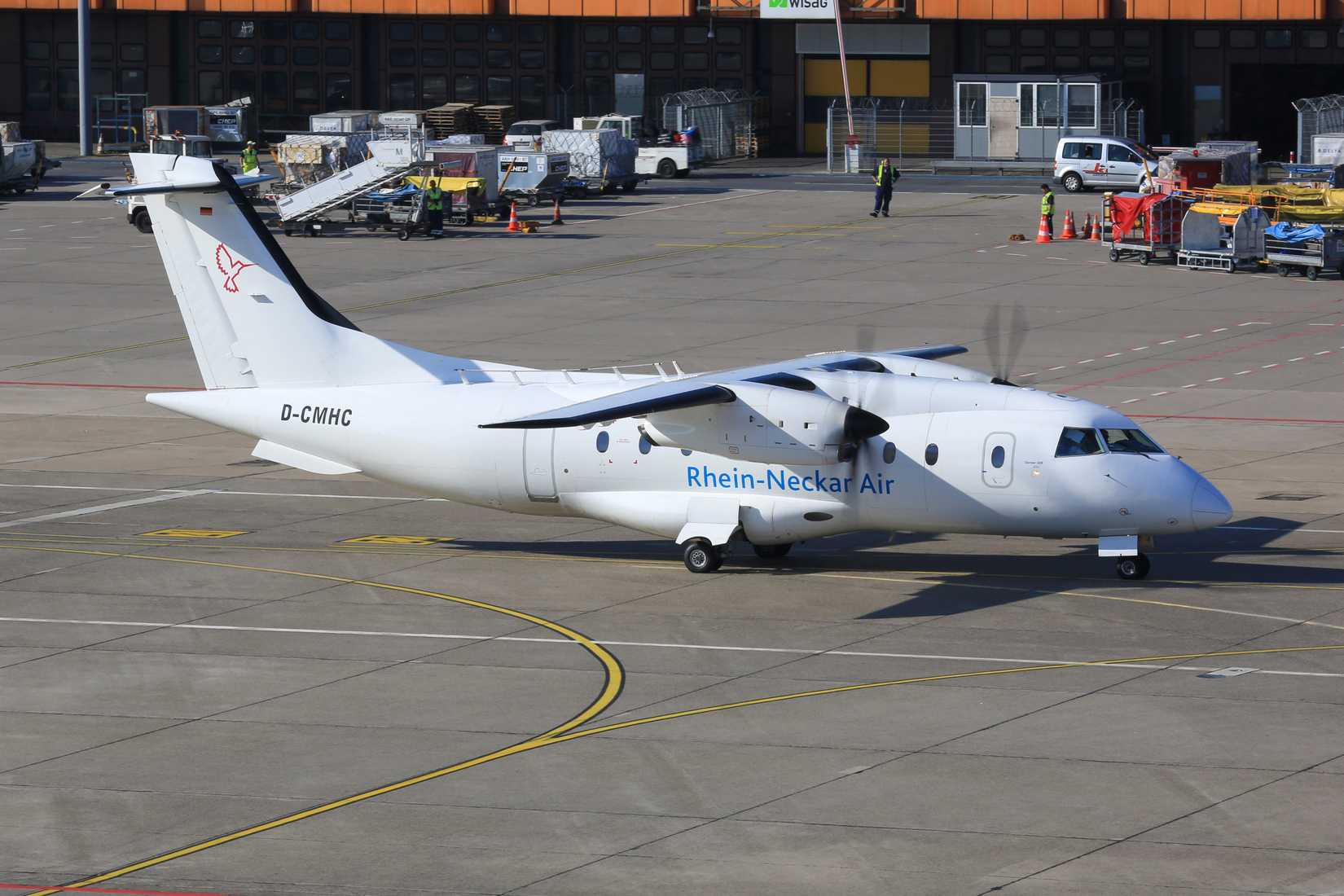 A Dornier 328 on an airport apron.