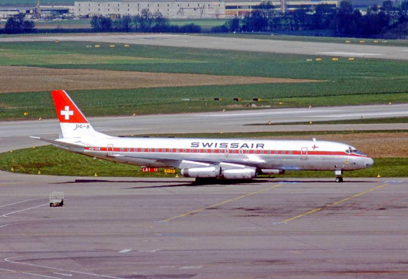 A Swissair Douglas DC-8 on an airport apron.