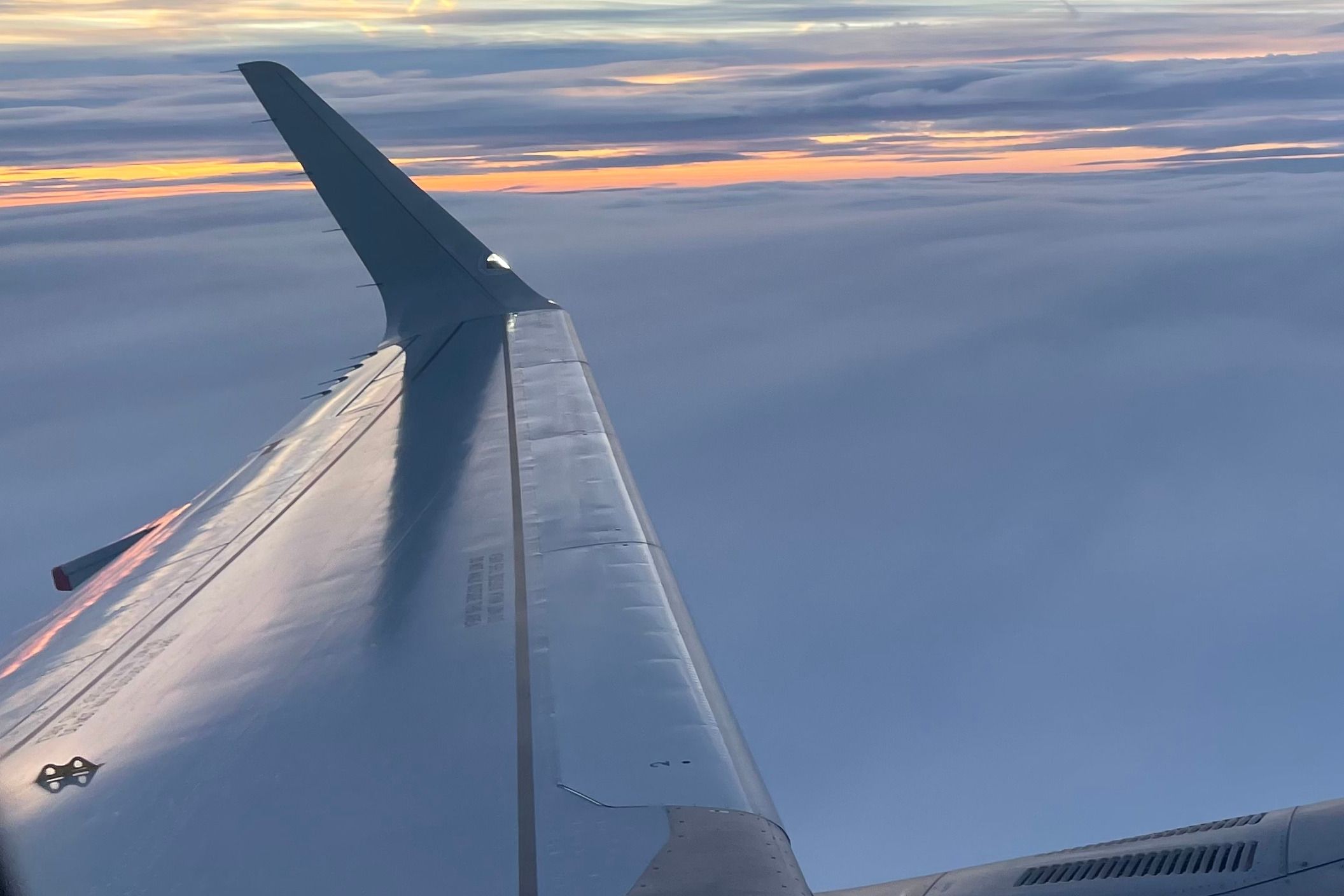 Explained: The Yellow Hooks On Airplane Wings That Could Save Your Life