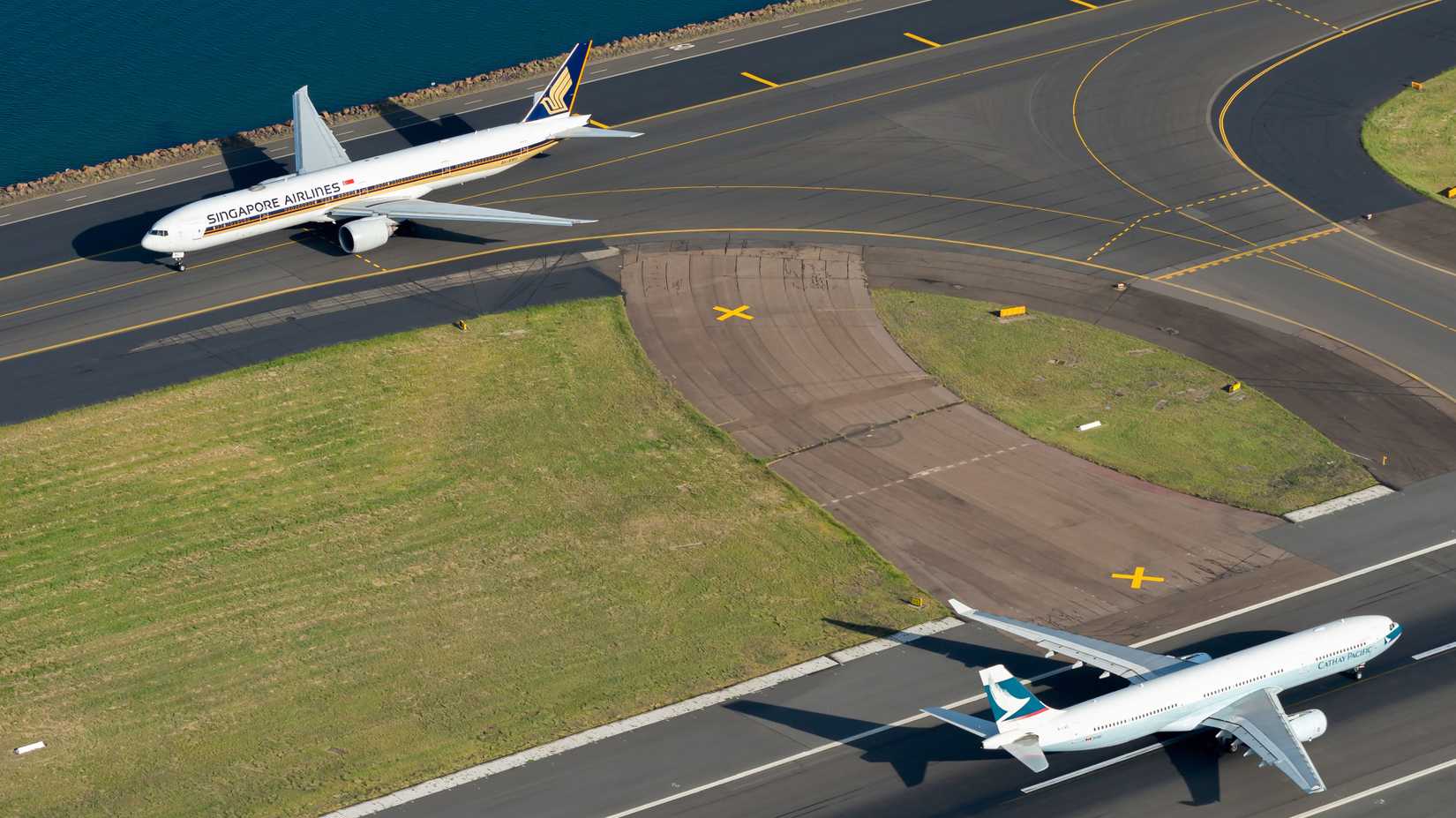 An Airbus A330 and Boeing 777 on the runway