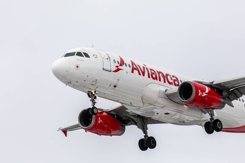 An avianca Airbus A320 flying in the sky.